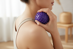 Person using purple massage ball